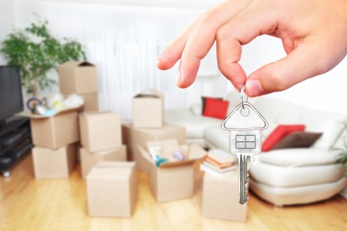 Professional movers handling furniture in an apartment block