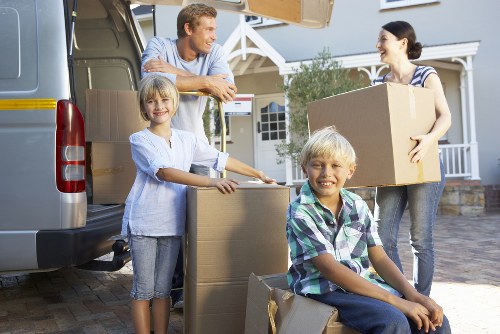 Moving boxes and furniture during a flat removal in Gantshill